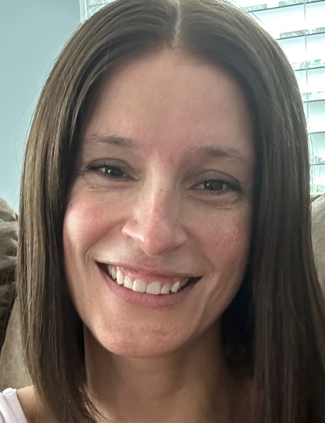 Customer wearing a brown straight lob wig