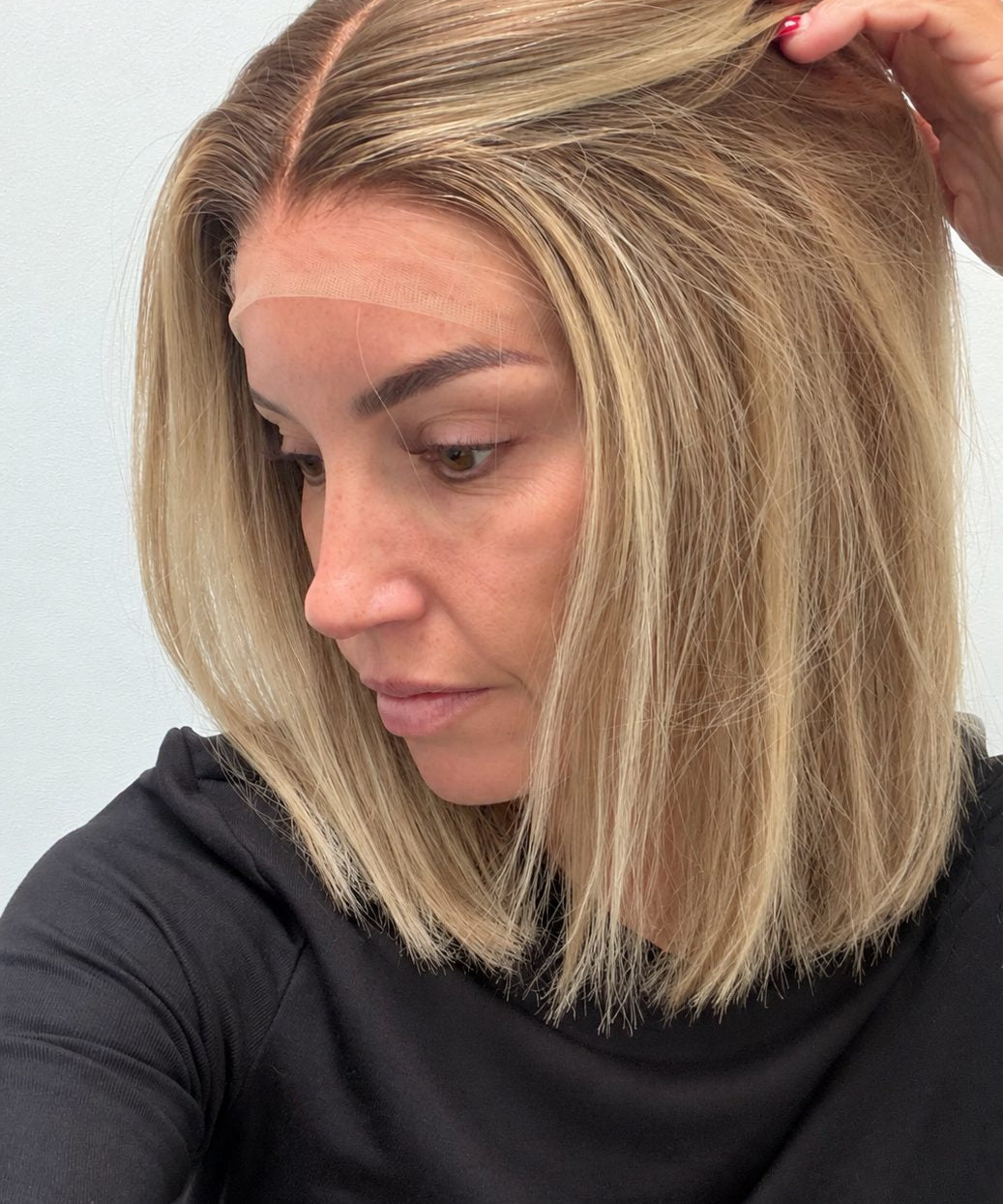 Champagne Melt 12-inch straight wig in rooted champagne blonde balayage, side view showing the hairline