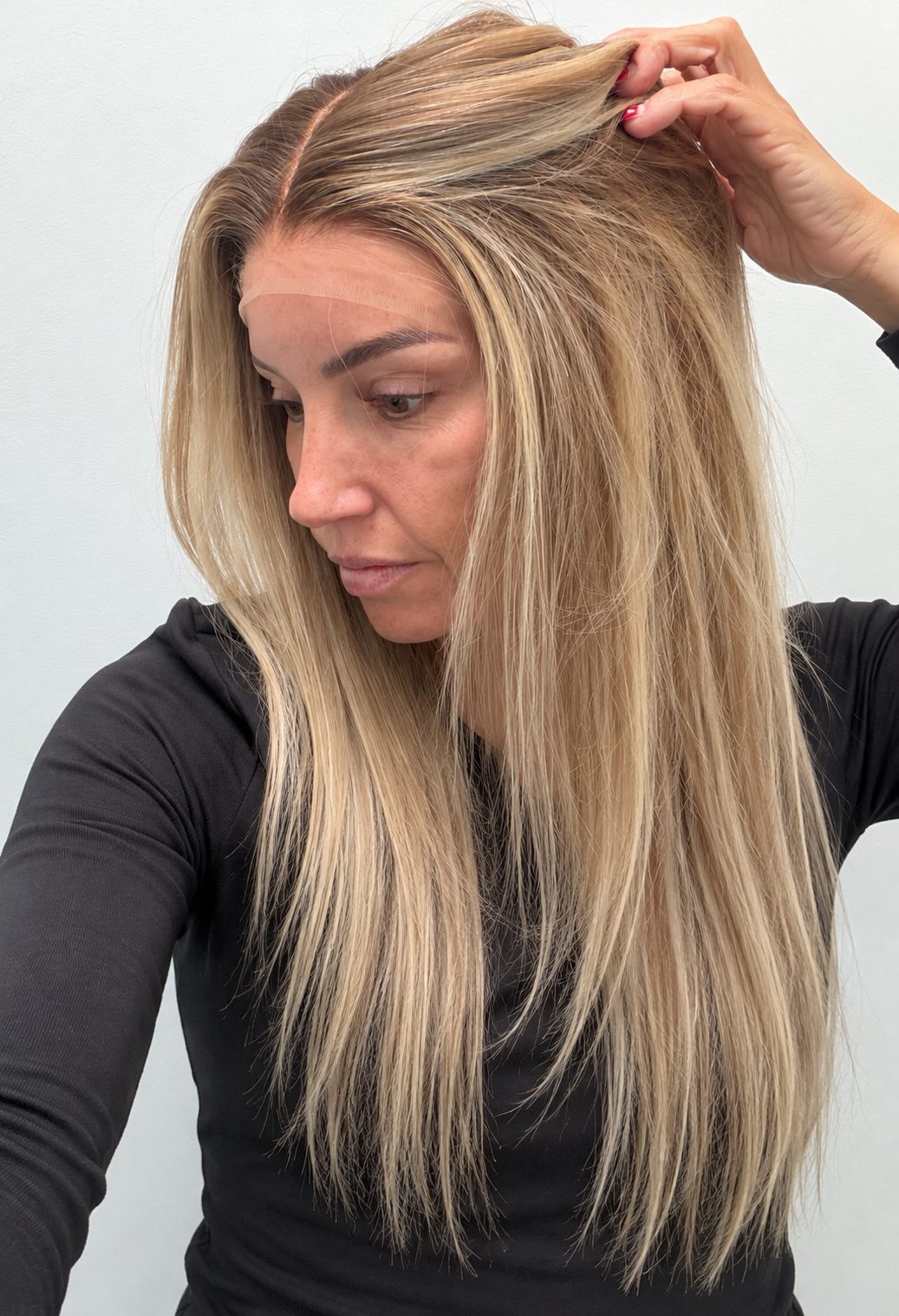 Champagne Melt 20-inch straight wig in rooted champagne blonde balayage, side view showing the hairline