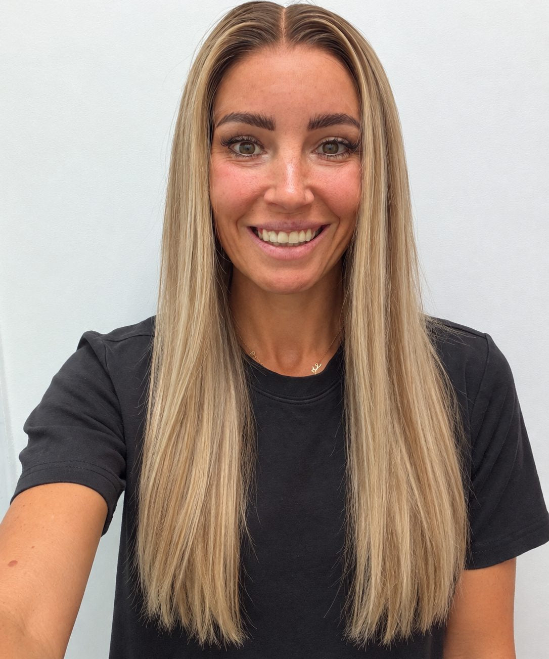 Champagne Melt 24-inch straight wig in rooted champagne blonde balayage, front view