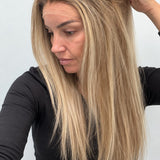 Champagne Melt 24-inch straight wig in rooted champagne blonde balayage, side view showing the hairline