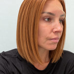 Copper Glow 12-inch straight wig in bright copper red, side view showing the hairline