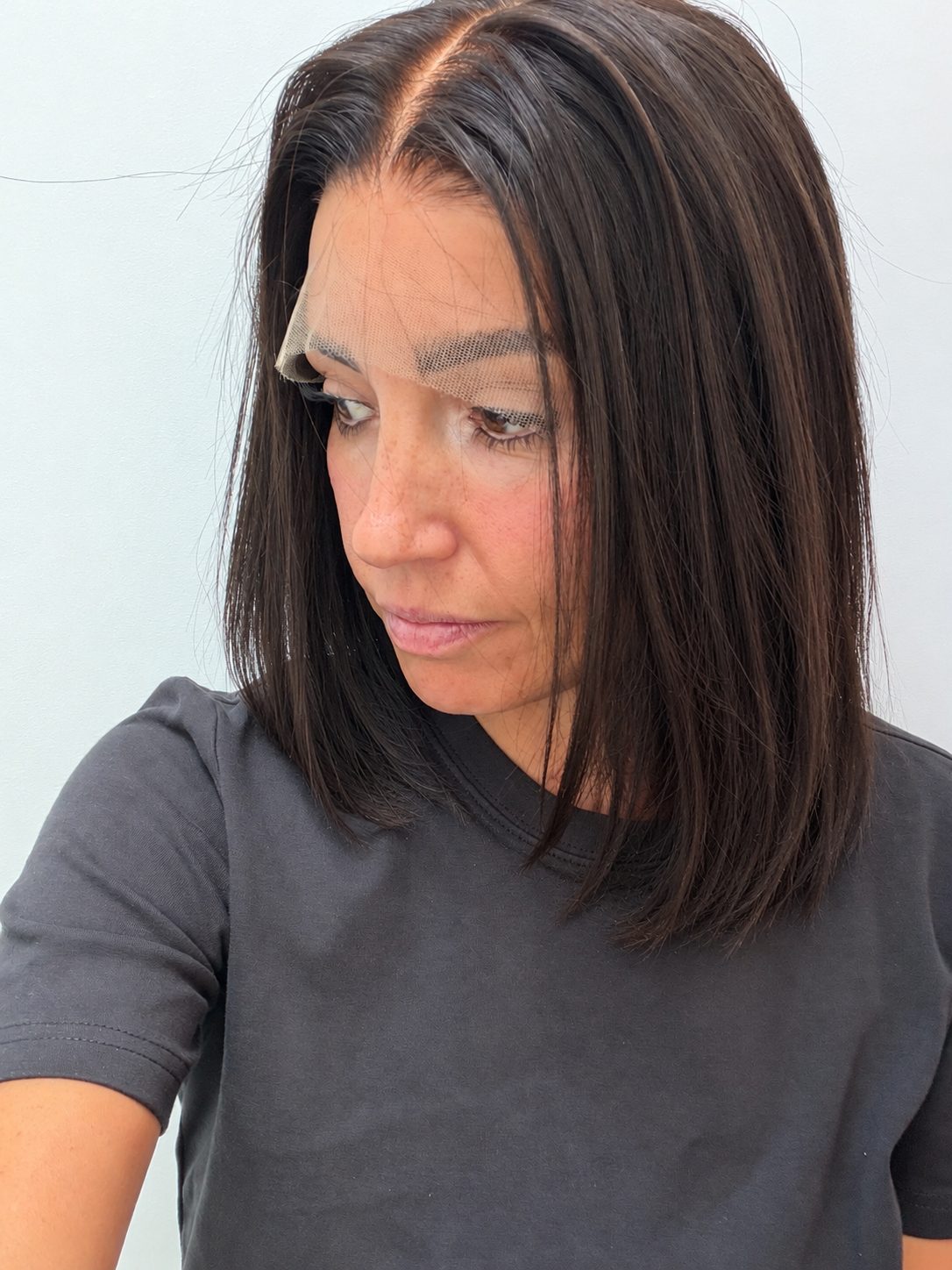 Espresso 12-inch straight wig in dark brown, side view showing the hairline