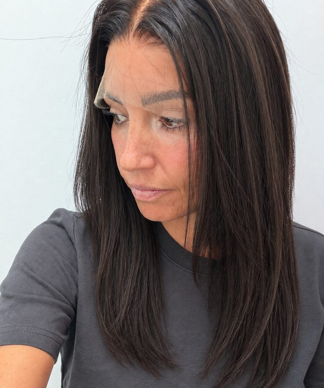 Espresso 16-inch straight wig in dark brown, side view showing the hairline