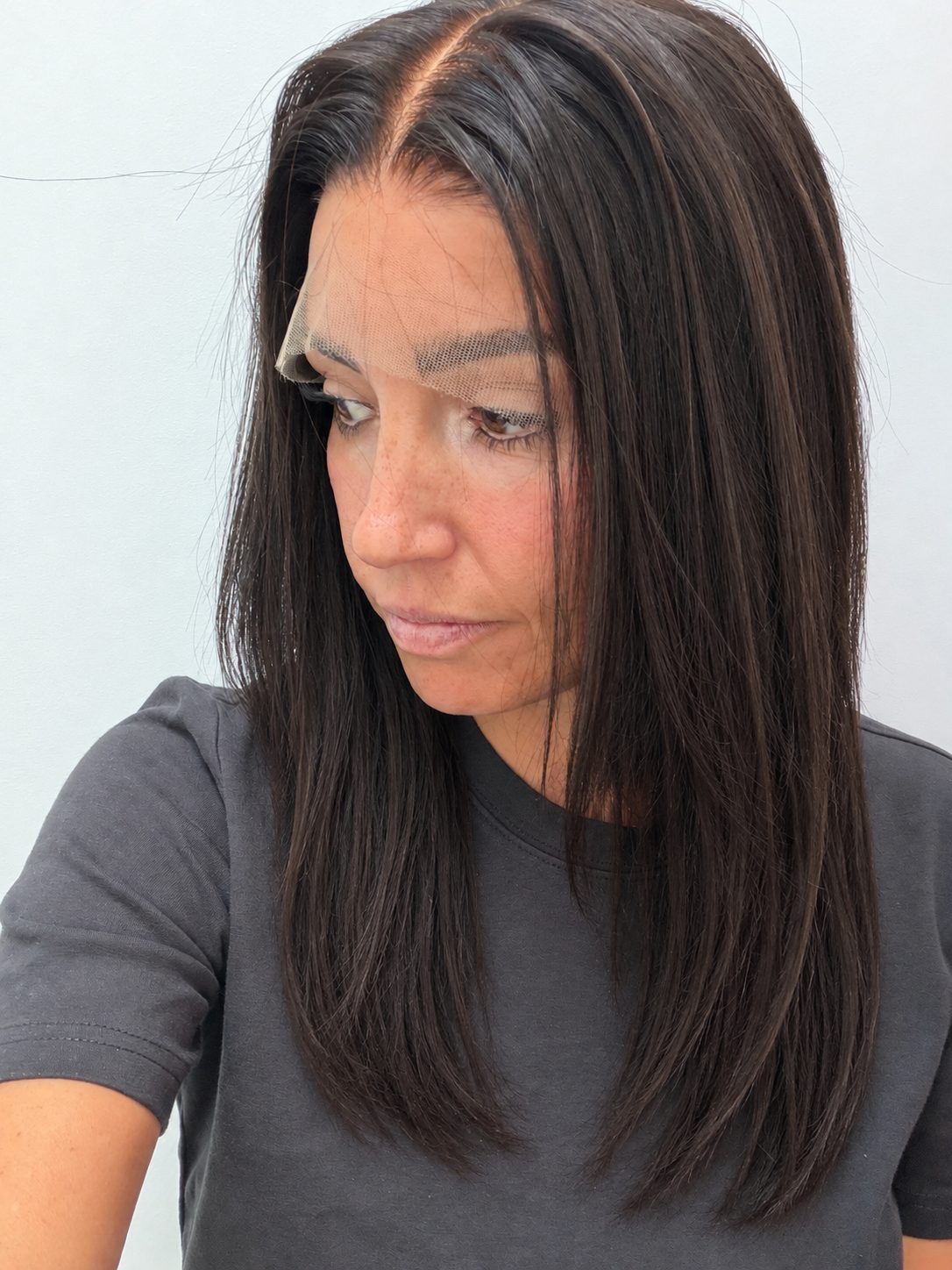 Espresso 16-inch straight wig in dark brown, side view showing the hairline