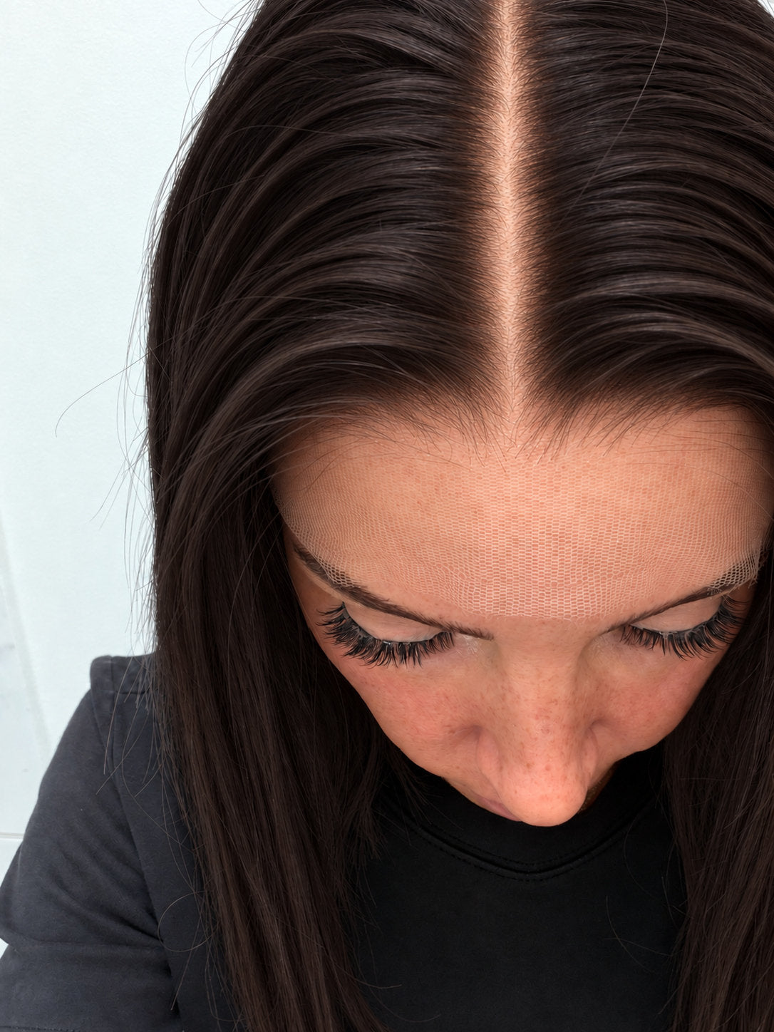 Close-up of the natural lace hairline and parting on an Espresso human hair wig in deep espresso brown