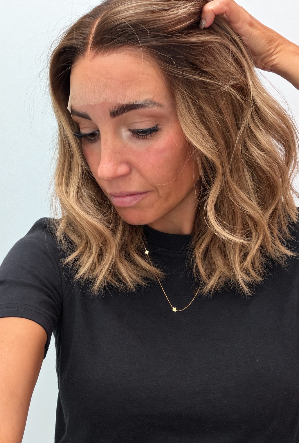 Golden Honey 12-inch wavy wig in golden blonde balayage, side view showing the hairline