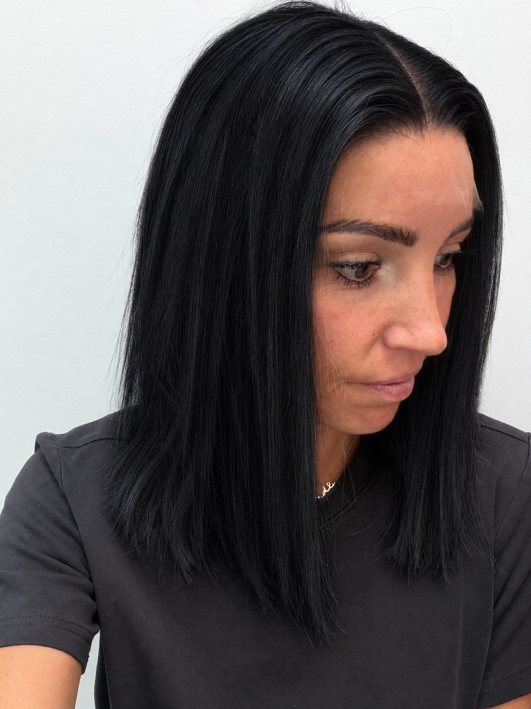 Midnight 14-inch blunt bob wig in jet black, side view showing the hairline