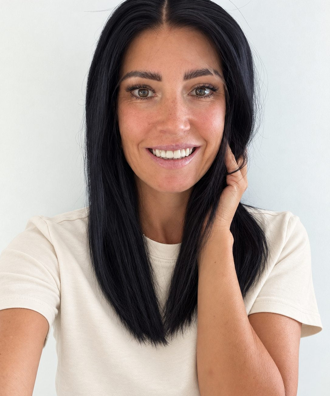 Midnight 16-inch layered straight wig in jet black, front view