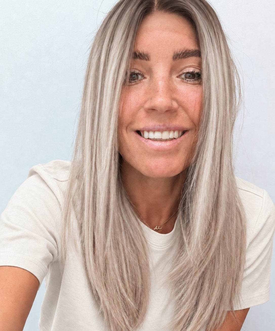 Nordic Pearl 18-inch layered straight wig in rooted platinum blonde, front view