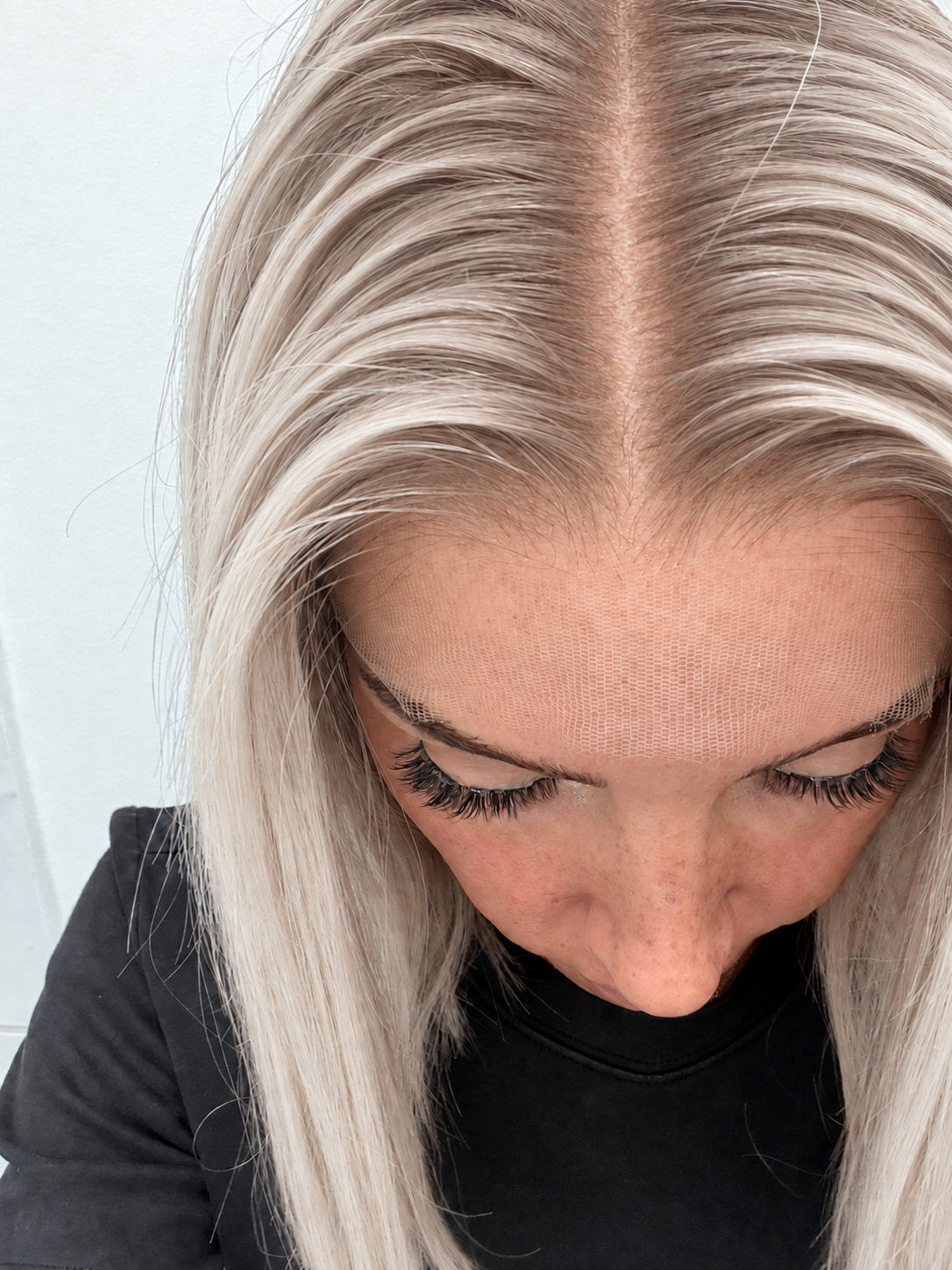 Close-up of the natural lace hairline and parting on a Nordic Pearl human hair wig