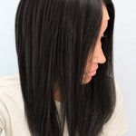 Soft Onyx 18-inch layered straight wig in soft natural black, side view showing the hairline