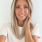 Vanilla Sand 16-inch layered straight wig in rooted beige blonde, front view